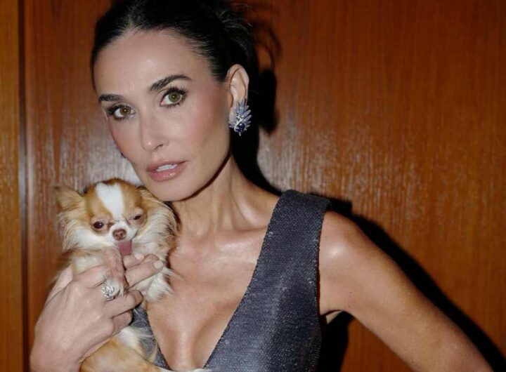 l'attrice demi moore con un cagnolino in mano